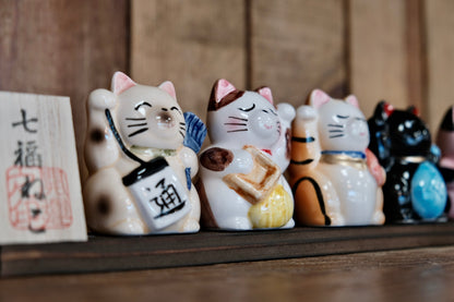 Japan Made Seven Lucky Cats with display board