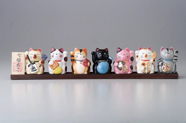 Japan Made Seven Lucky Cats with display board